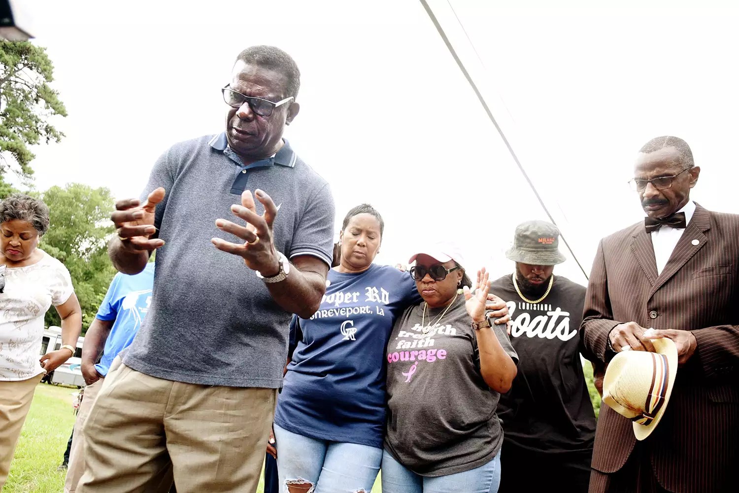 Damon Humphrey prays Thursday evening, July 6, 2023, at the corner of Jones Mabry and Pearl for victims of the July 4th mass shooting in Shreveport.