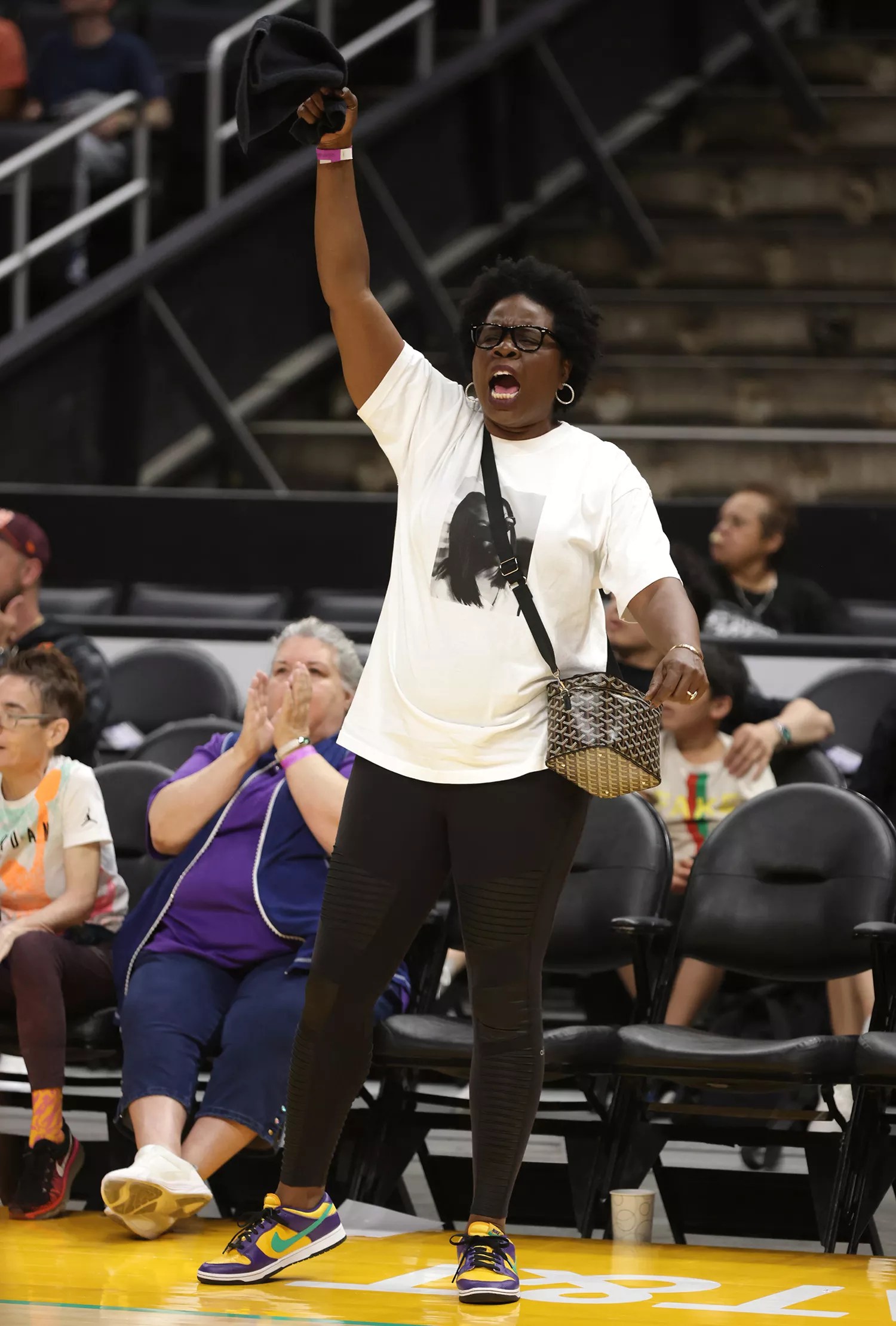 Leslie Jones cheers ahead of a game between the New York Liberty and the Los Angeles Sparks