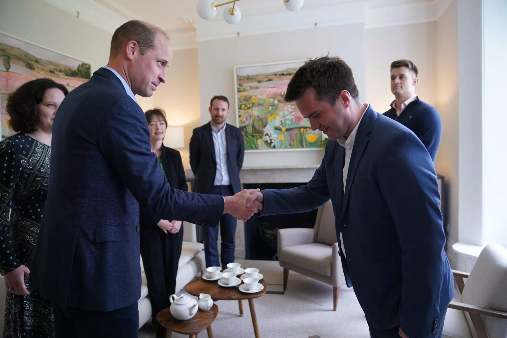 Britain&rsquo;s Prince William greets Rob Kent during a visit to the new center of James' Place in London, Tuesday, May 3 2022, to learn more about the charity&rsquo;s work to save the lives of men experiencing a suicidal crisis. (Yui Mok/Pool Photo via AP)