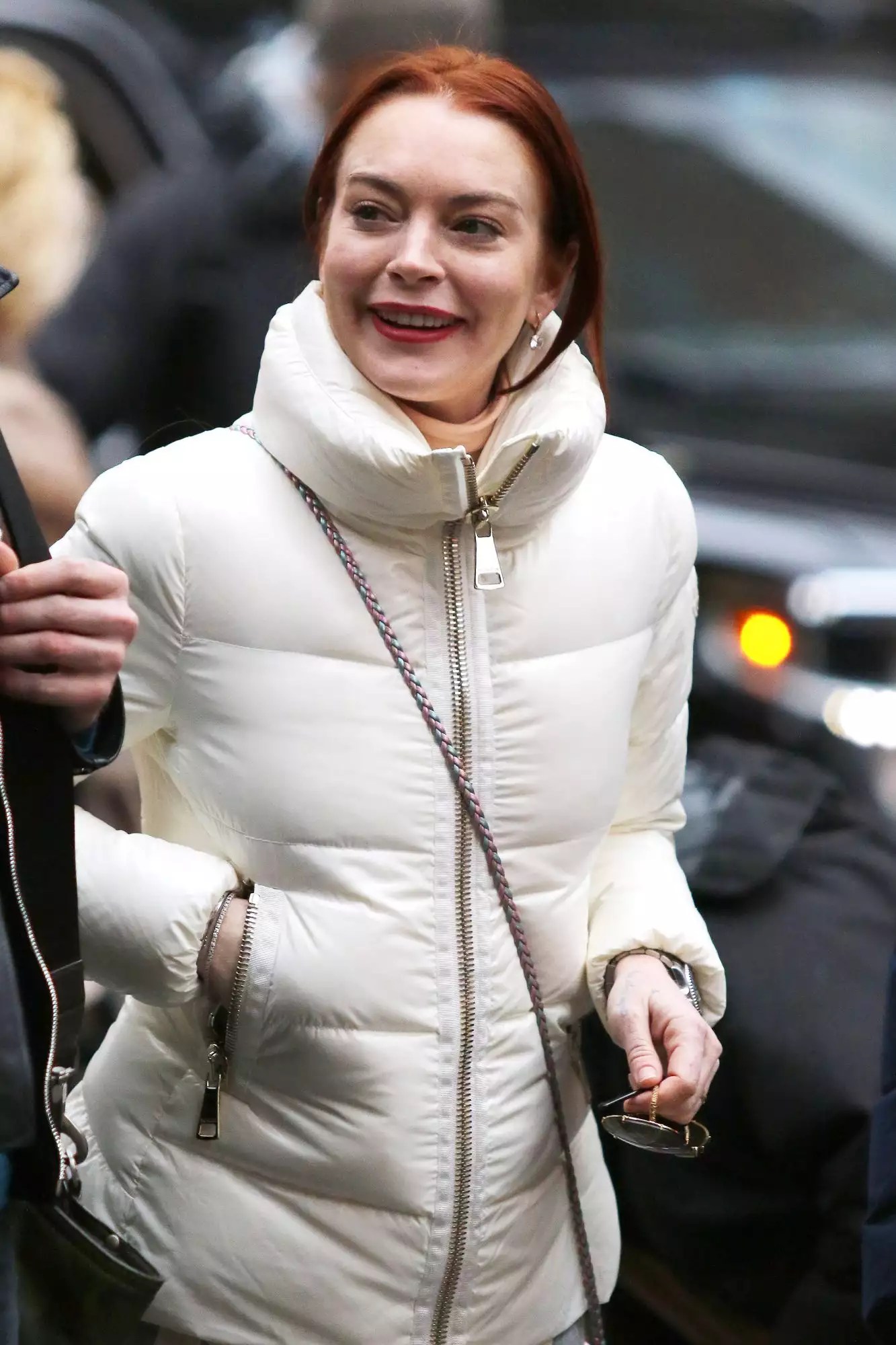 Lindsay Lohan is all smiles on a rainy day in New York City