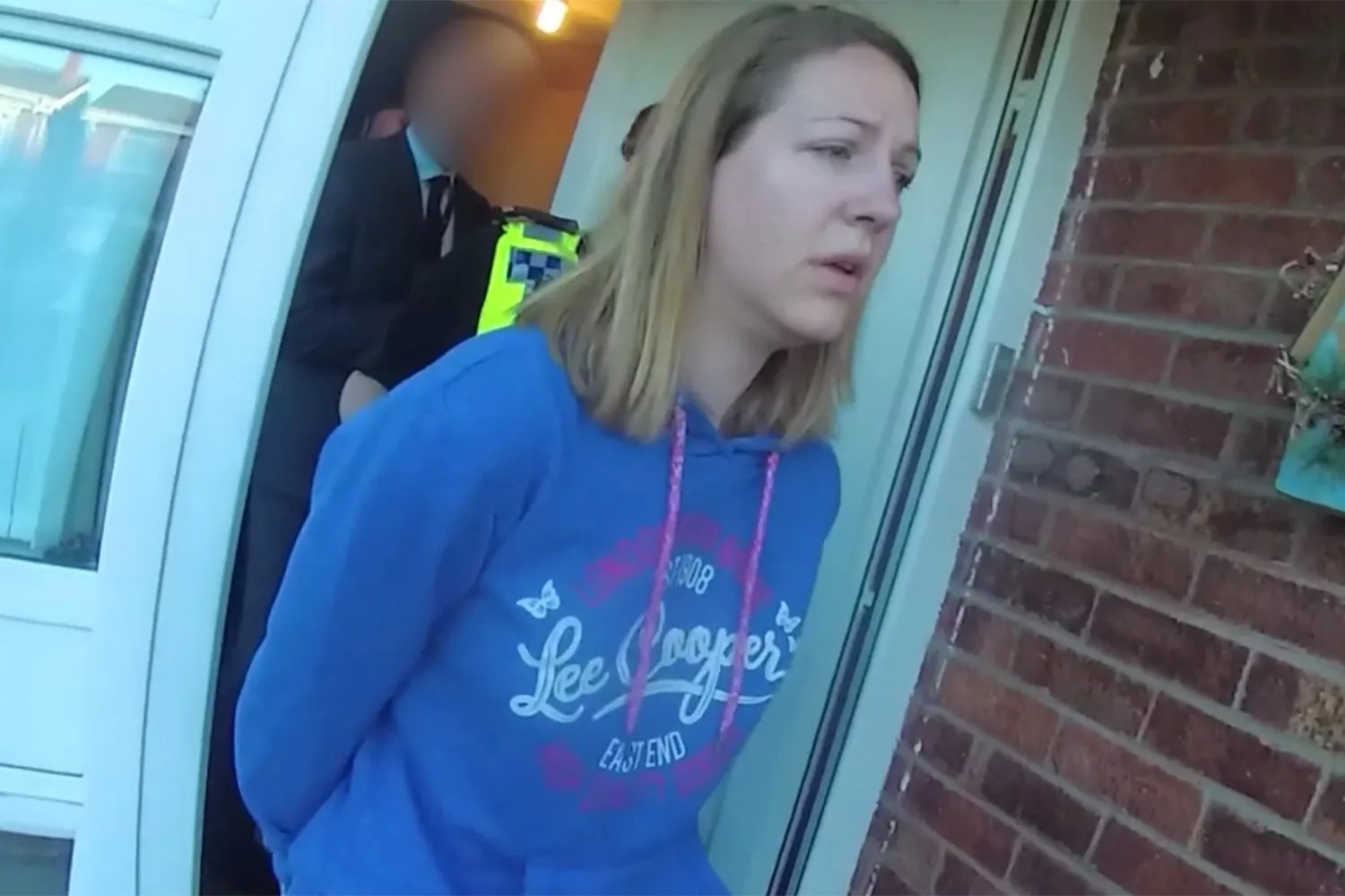 A screenshot from footage of Lucy Letby&rsquo;s first arrest at her home in Chester on 3 July 2018.