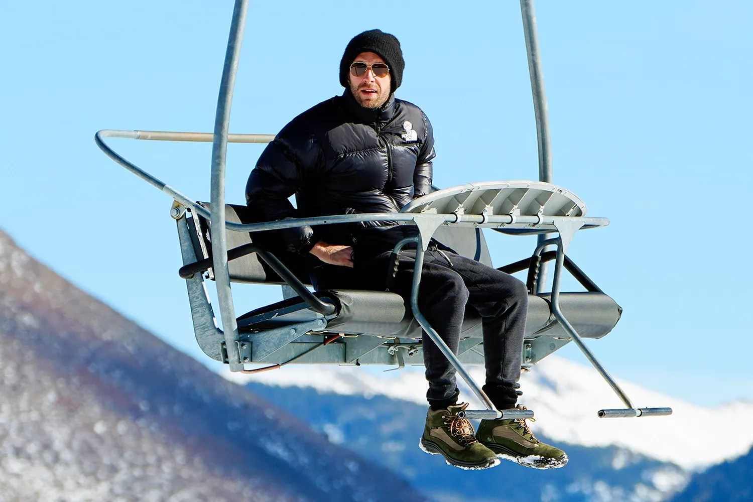 Chris Martin takes a solo trip up a ski lift for some sight seeing in Aspen Colorado