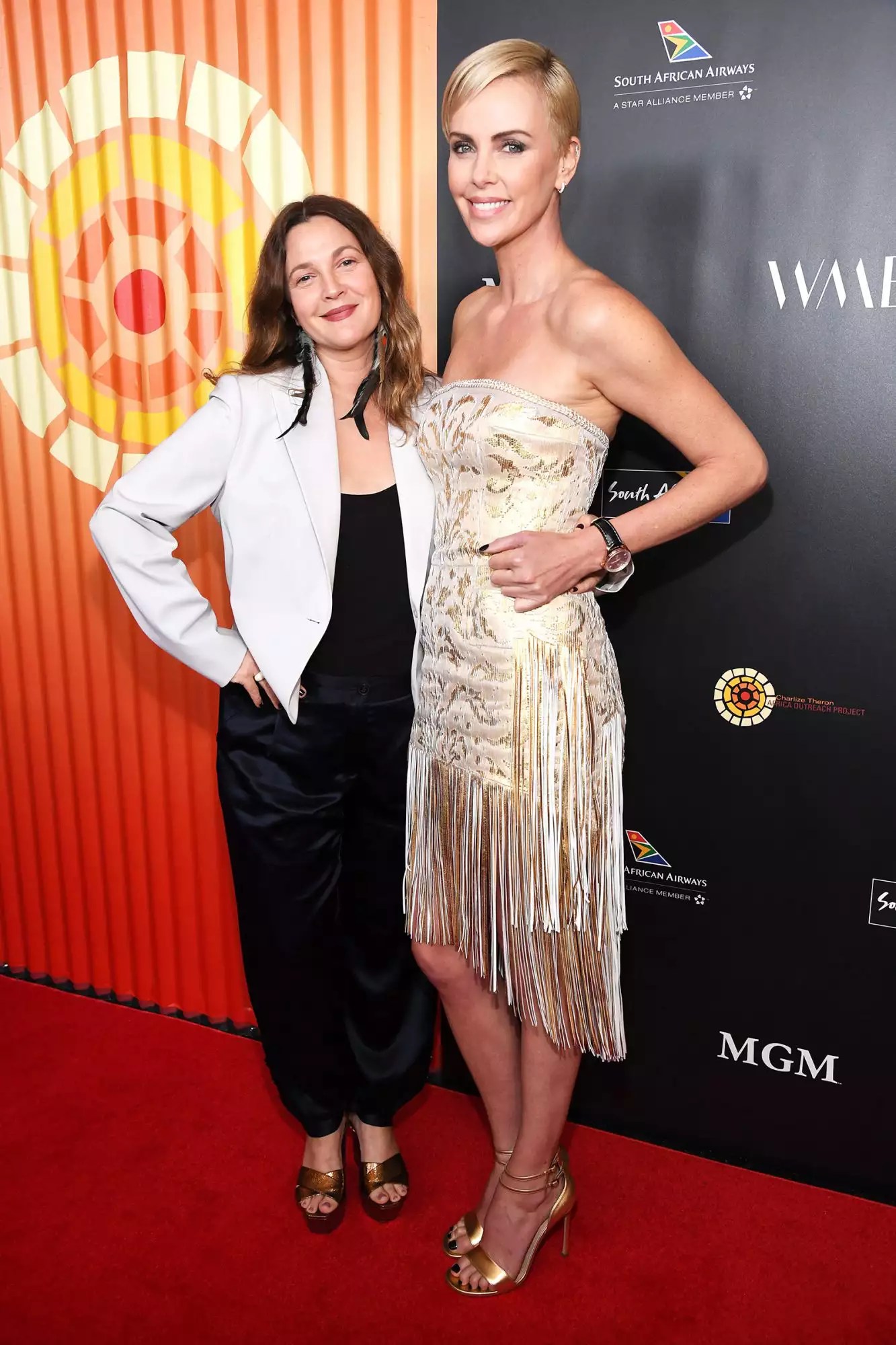 Drew Barrymore and Charlize Theron attend The Charlize Theron Africa Outreach Project fundraising event at The Africa Center on November 12, 2019 in New York City