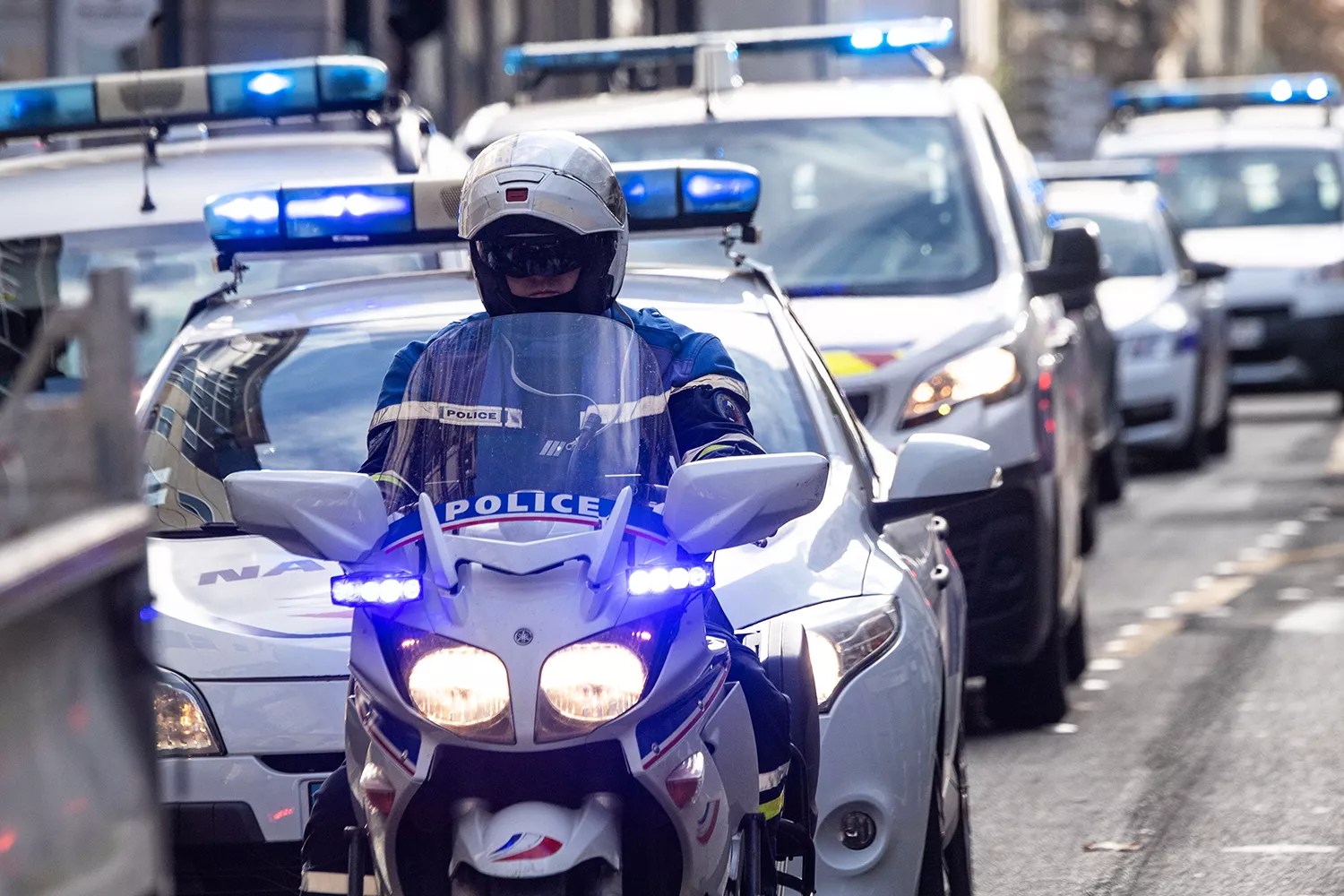 Police officers drive their cars and motorcycles with flashing lights and sirens blaring to protest against violences, after three of their colleagues have been injured during the December 5 demonstration, in Nantes, western France, on December 10, 2020.