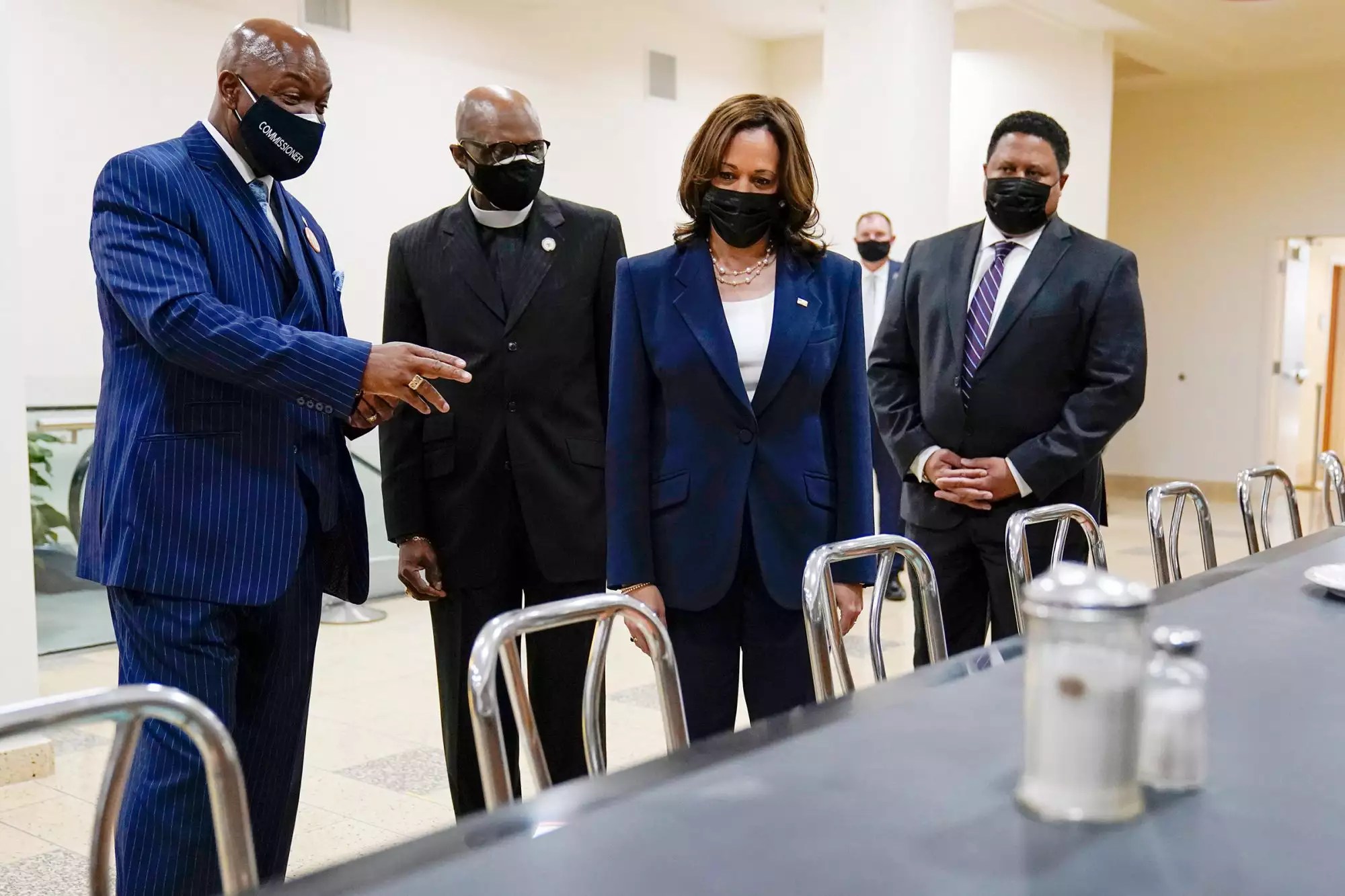 Vice President Kamala Harris sits at a segregated lunch counter where Rosa Parks