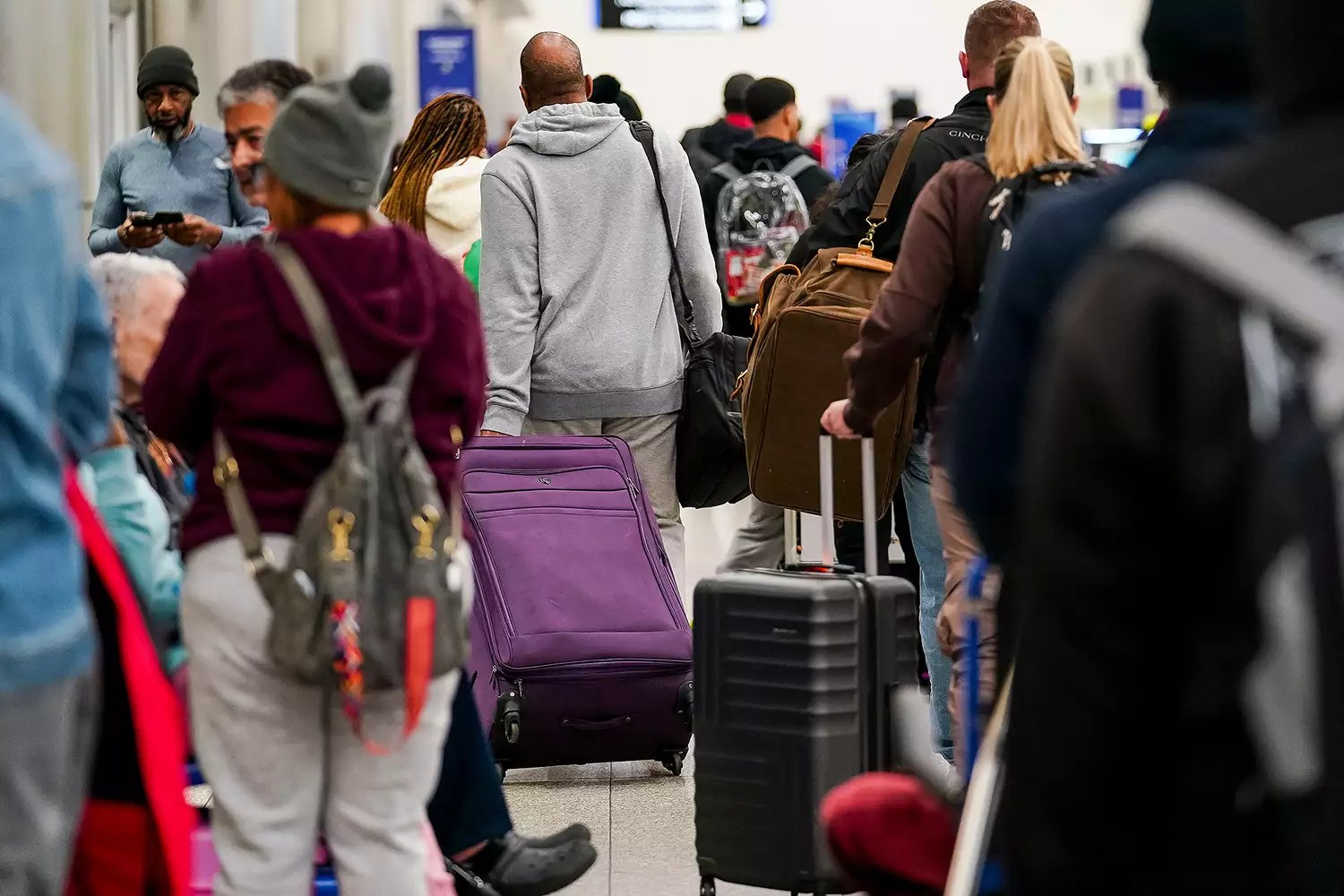 Travelers at Hartsfield-Jackson Atlanta International Airport (ATL) in Atlanta, Georgia, US, on Wednesday, Nov. 27, 2024. AAA projects 79.9 million travelers will head 50 miles or more from home over the Thanksgiving holiday travel period.