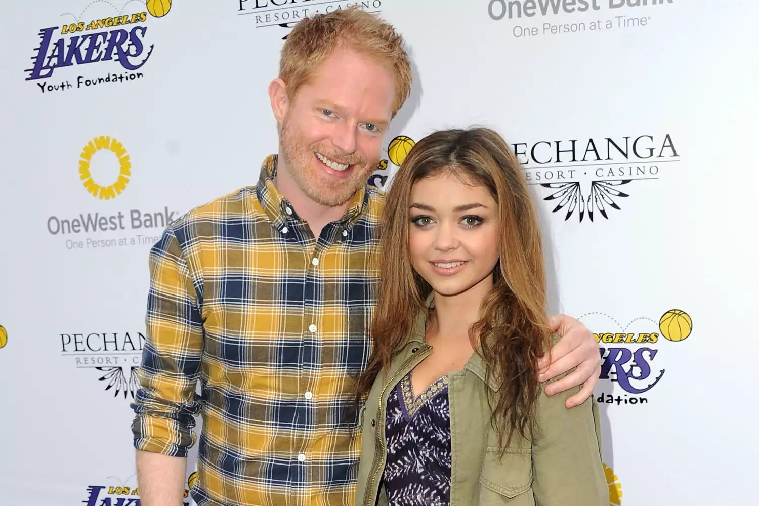 LOS ANGELES, CA - MARCH 10: Actor Jesse Tyler Ferguson (L) and actress Sarah Hyland attend the Lakers Casino Night fundraiser benefiting the Lakers Youth Foundation at Club Nokia on March 10, 2013 in Los Angeles, California. (Photo by Allen Berezovsky/WireImage)