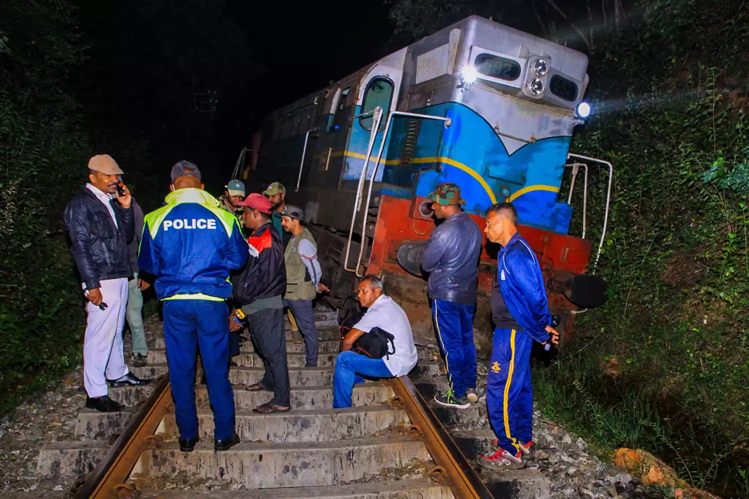 Police and railway personnel examine a derailed train at Habarana in eastern Sri Lanka on February 20, 2025, which killed six elephants.