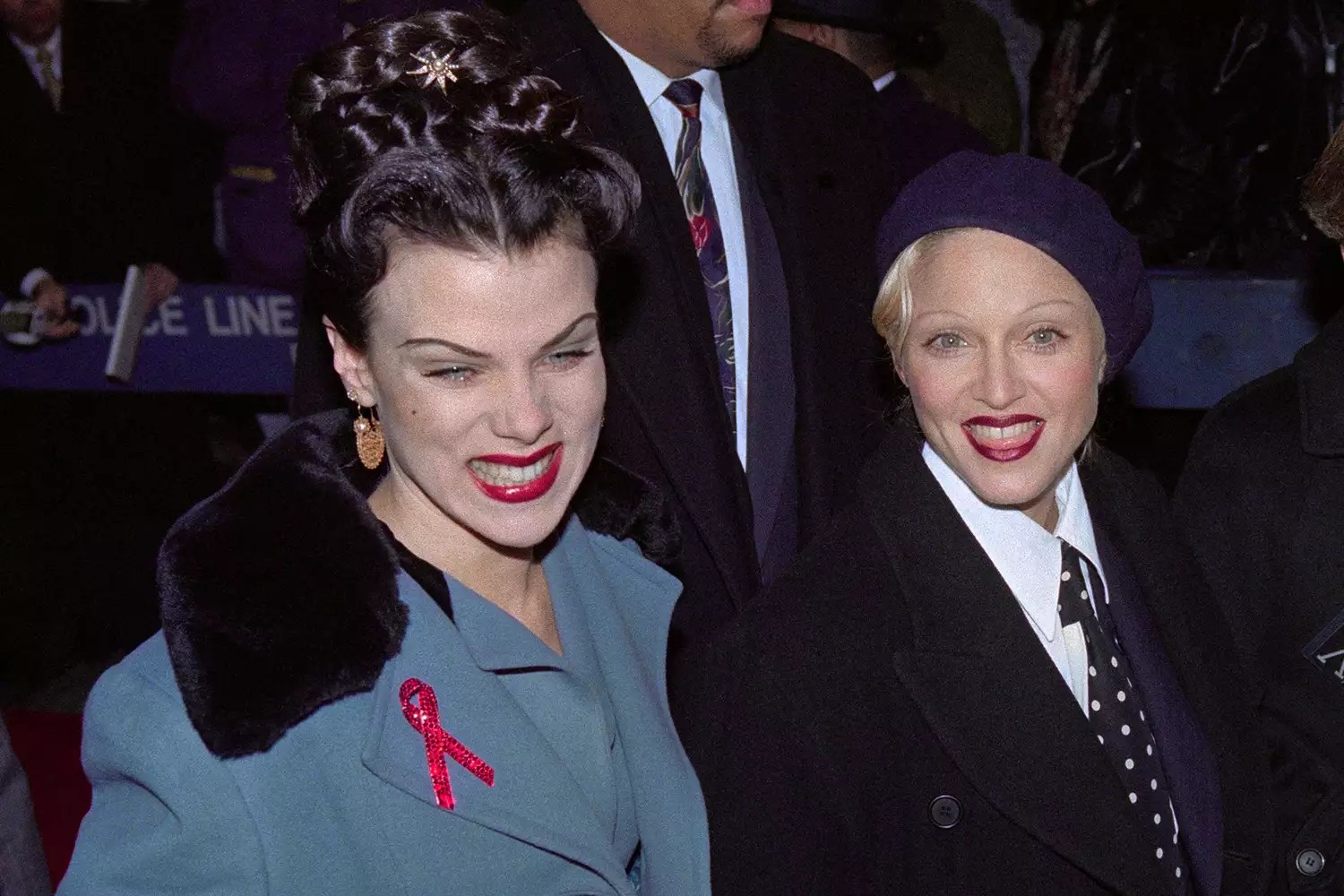 Madonna (C) arrives on the arm of friend actress Debi Mazar (L) at the world premiere of Spike Lee&rsquo;s movie Malcom X