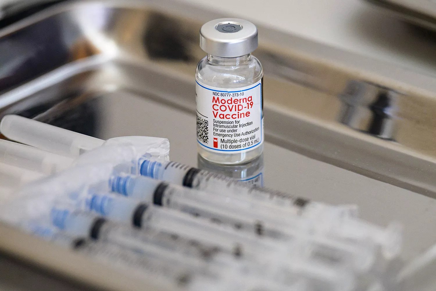 A vial of the Moderna Covid-19 vaccine and syringes sit prepared at a pop up vaccine clinic at the Jewish Community Center on April 16, 2021 in the Staten Island borough of New York City.