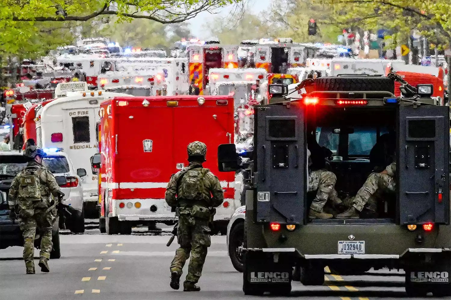 Local and Federal law enforcement respond to a reported shooting near the 2900 block of Van Ness Street in Northwest, Washington, DC on April 22, 2022. (Photo by Olivier DOULIERY / AFP) (Photo by OLIVIER DOULIERY/AFP via Getty Images)