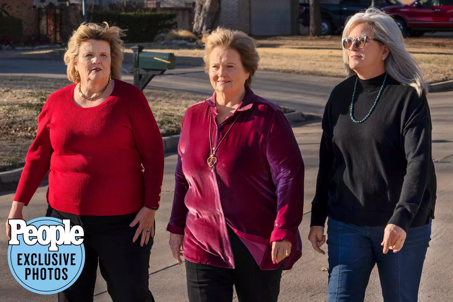 Tina Ennis (left) and Jill Lopez (right), who were switched birth, walk with Jill’s bio mom Kathryn Jones in Duncan, OK on March 12, 2022