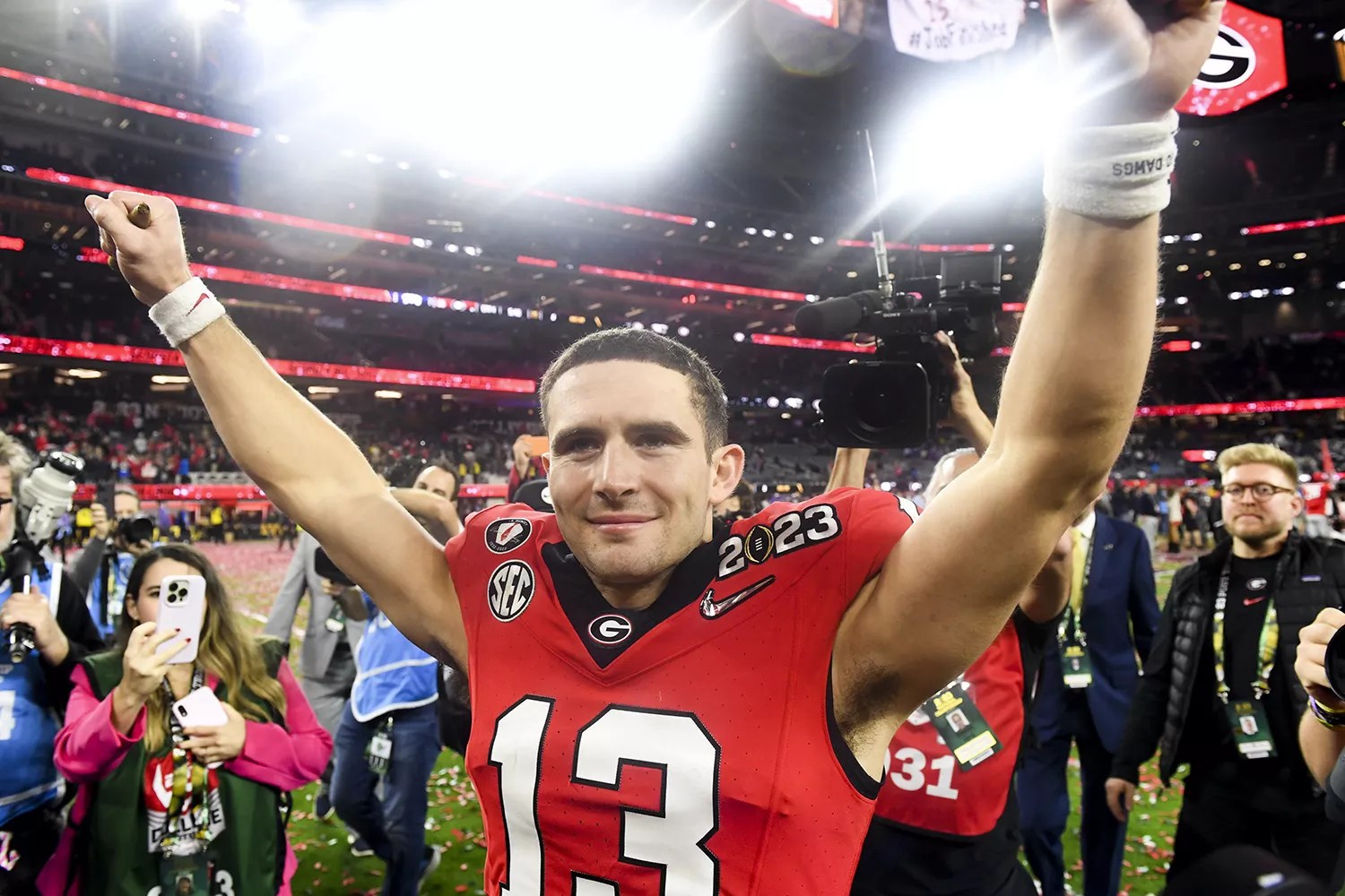 Georgia Bulldogs quarterback Stetson Bennett (13) celebrates after defeating TCU Horned Frogs 65-7 in the CFP National Championship game