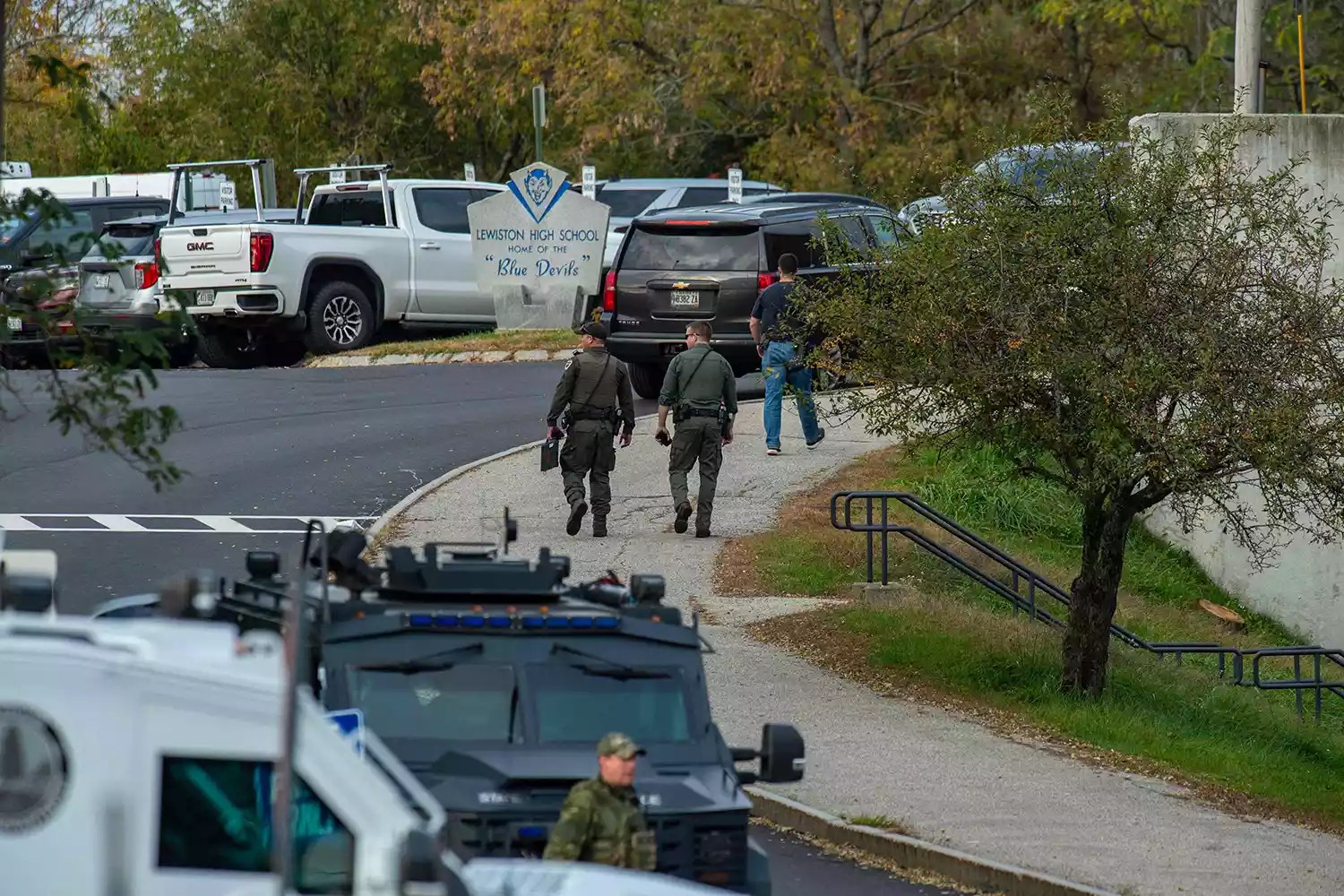 Law enforcement officers gather outside Lewiston High School, Maine on October 26, 2023