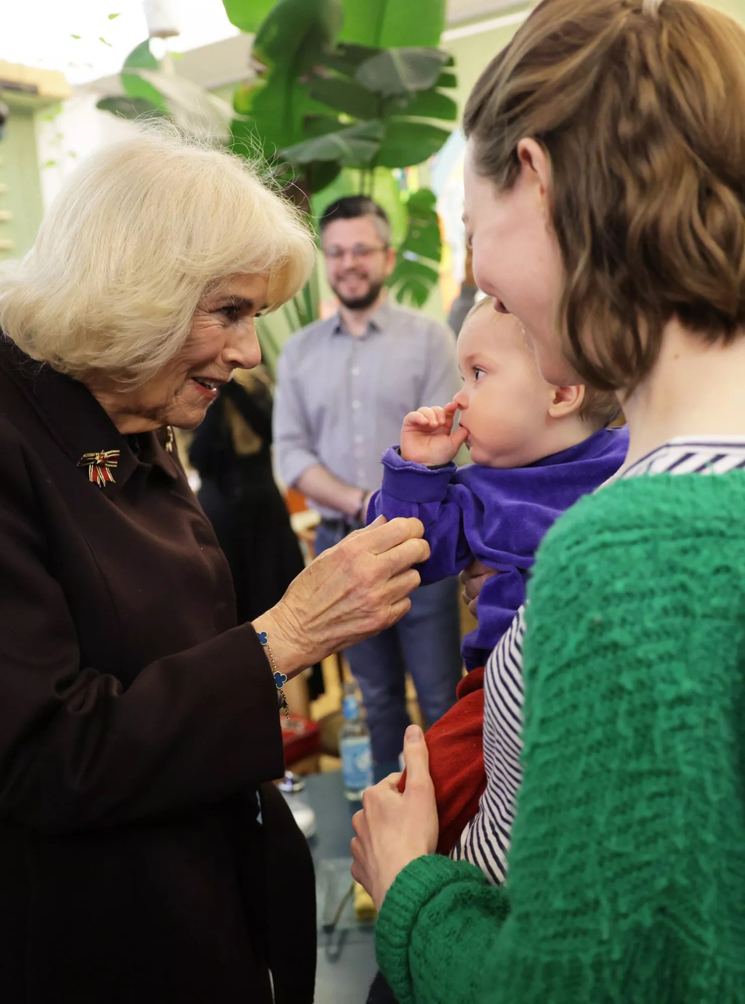 Camilla, Queen Consort and First Lady Elke Büdenbender visit Refugio Berlin and speak with Diana Strassheim and Baby Kuno on March 30, 2023 in Berlin, Germany