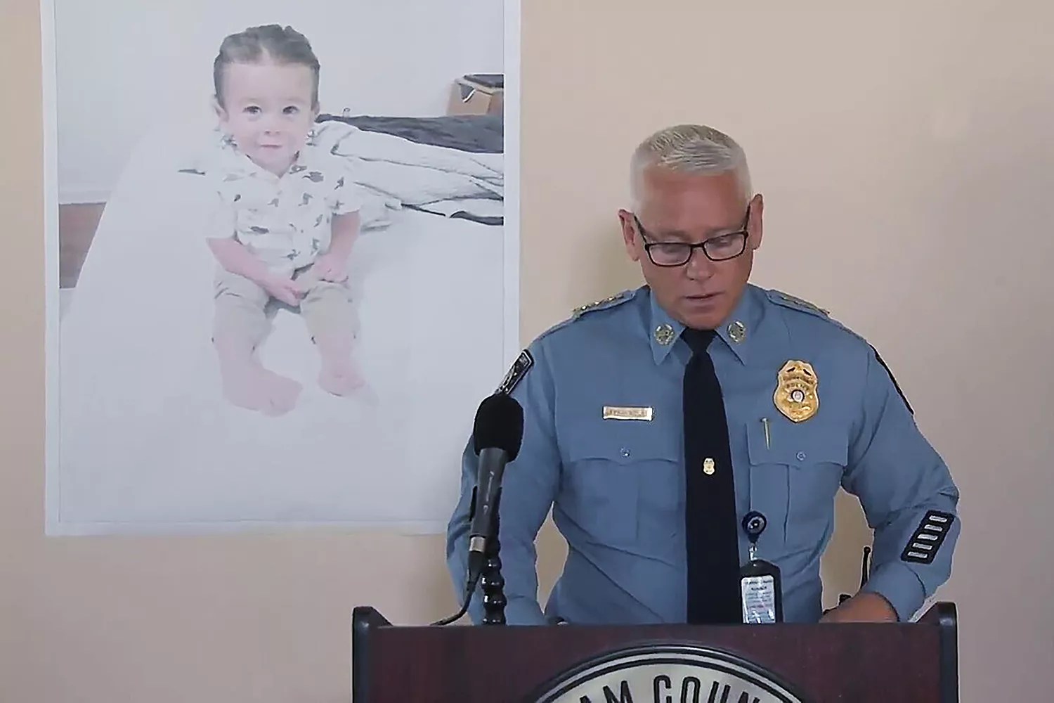 Chatham County Police Chief Jeff Hadley speaks to reporters as he stands in front of a large photo of missing toddler Quinton Simon at a police operations center being used in the search for the boy&rsquo;s remains just outside Savannah, Ga., . Quinton was reported missing from his home Oct. 5, 2022, by his mother Missing Toddler-Georgia, Savannah, United States - 18 Oct 2022