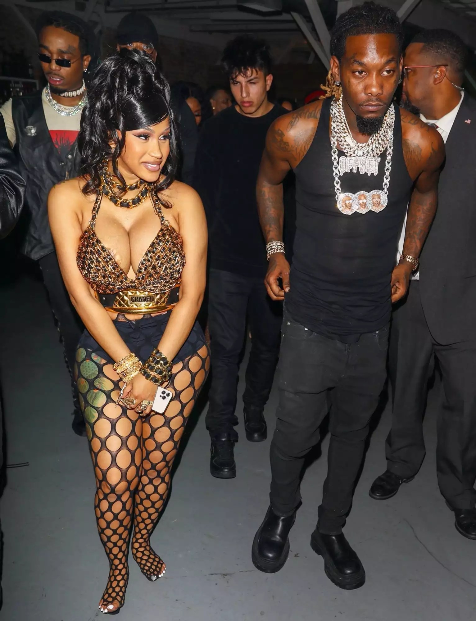 Cardi B is a showstopper as she exits her star-studded 29th birthday party with hubby Offset in Los Angeles. Cardi made sure to put her curvy physique on display donning an animal print bra-shirt with black fishnet stockings and heels.
