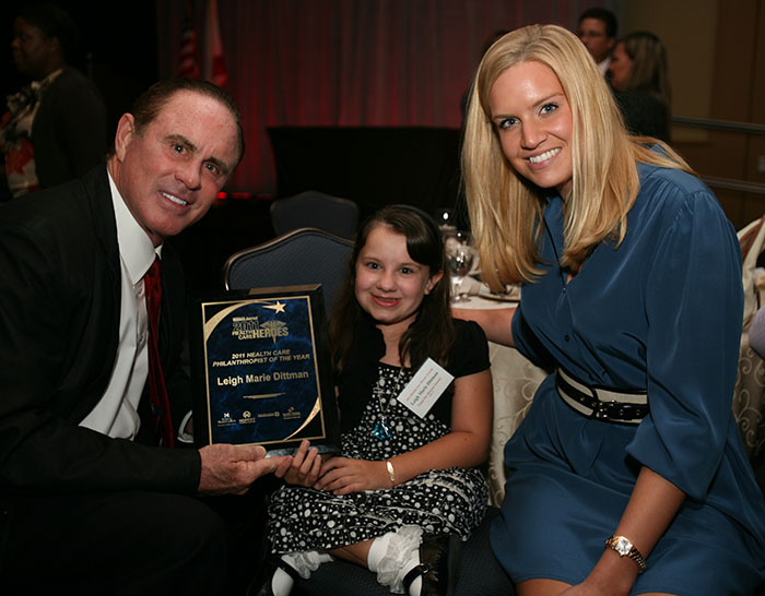 TBBJ's 2011 Health Care Heroes, Leigh Dittman celebrates with Tom and