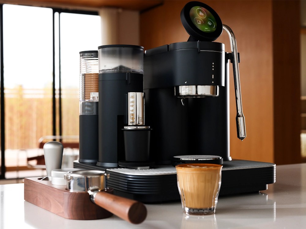 - Healthy Brew Hub A Meraki home espresso machine next to a milk-based coffee drink.