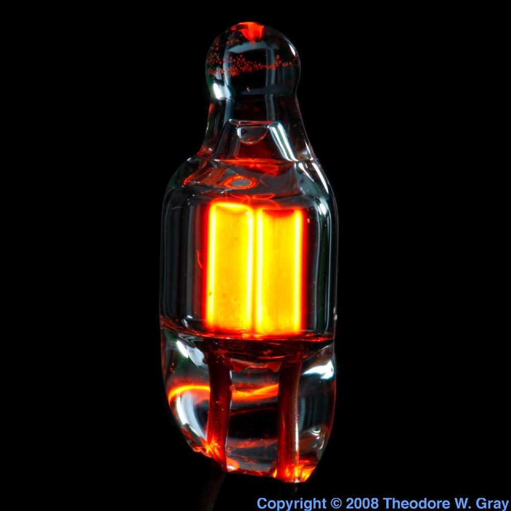 Tiny neon bulb lit, a sample of the element Neon in the Periodic Table