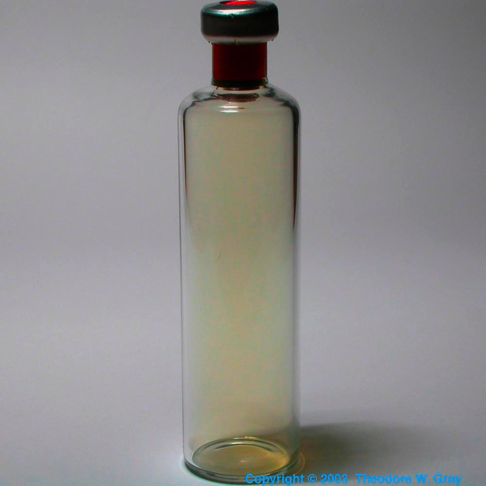 Gas in vial, a sample of the element Chlorine in the Periodic Table