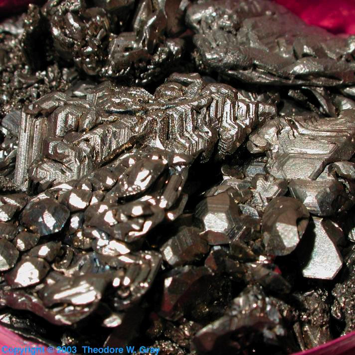 Electrochemically grown crystals, a sample of the element Titanium in