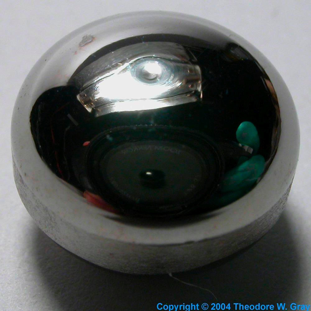 Singlecrystal button, melted, a sample of the element Tungsten in the