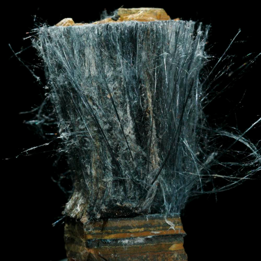 Riebeckite asbestos, a sample of the element Iron in the Periodic Table