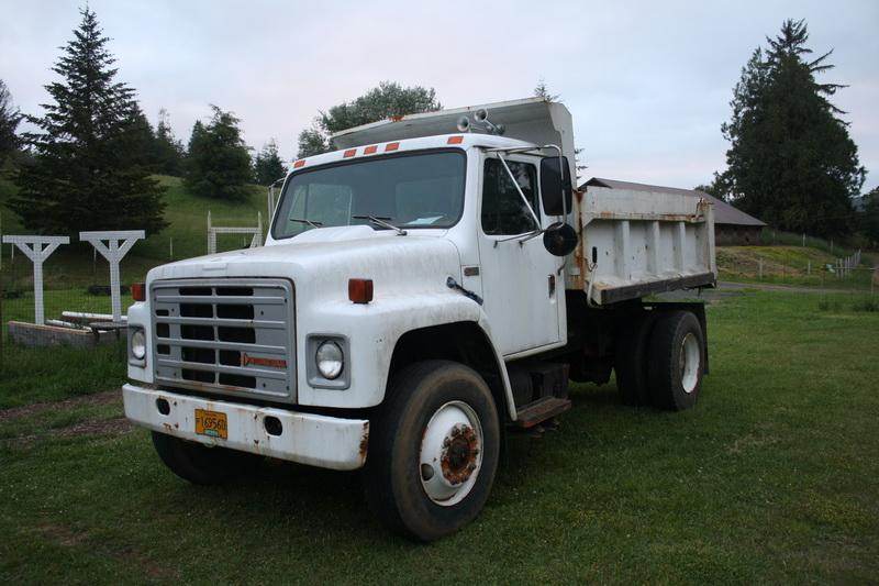 International 5 yard dump truck and 25,000 lb. capacity equipment
