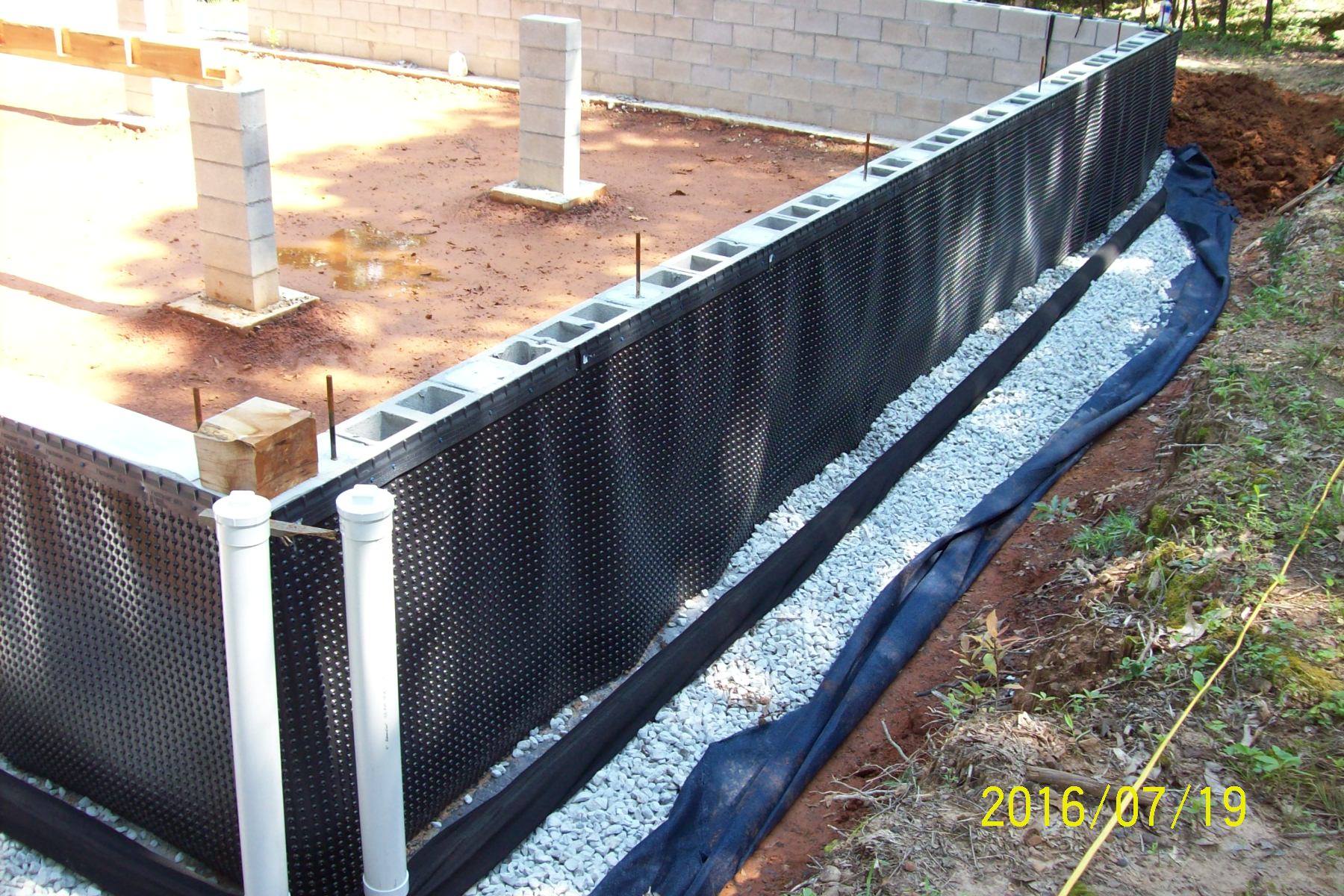 How do I attach EPDM to concrete underground? (wofati and earth berm