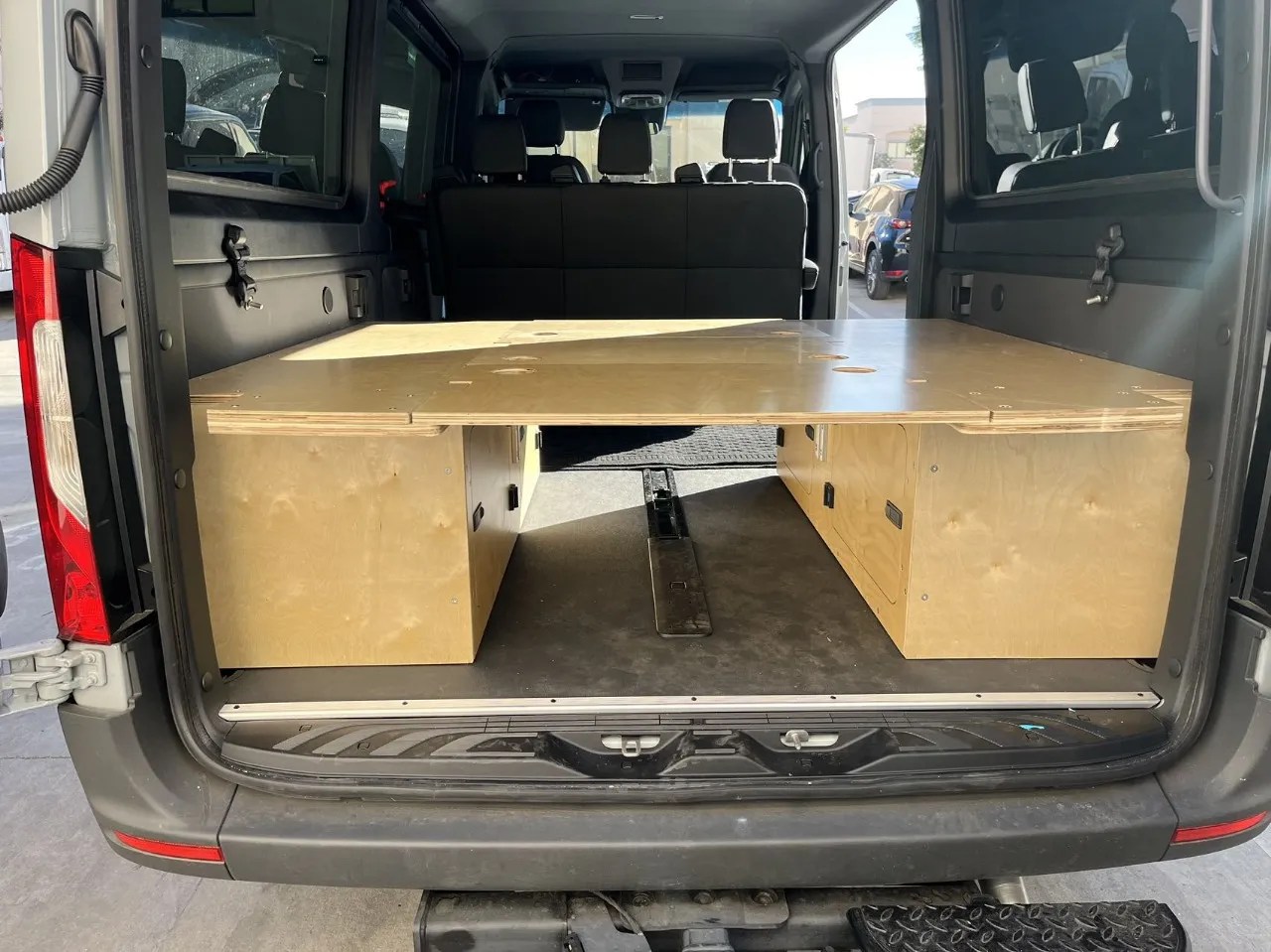 Sprinter passenger custom bed with two removable table