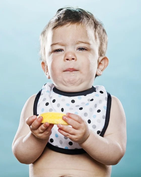 Portraits of Toddlers Reacting to Tasting a Lemon for the First Time
