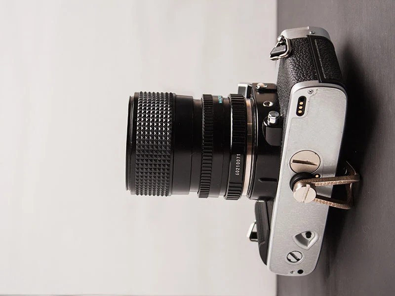 HANGIE is a Minimalist Wall Mount for Displaying Cameras