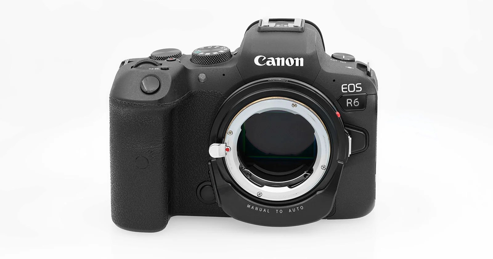 A Canon EOS R6 mirrorless camera body with a lens adapter attached, shown against a white background.