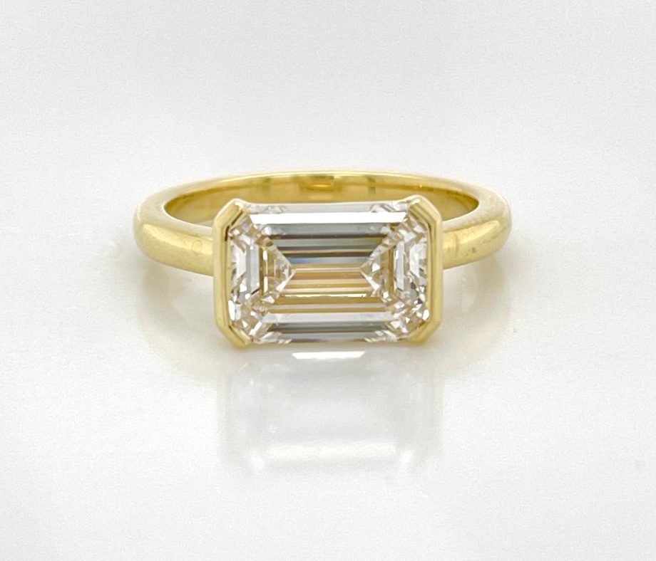 EastWest Half Bezel EmeraldCut Ring Peter Norman