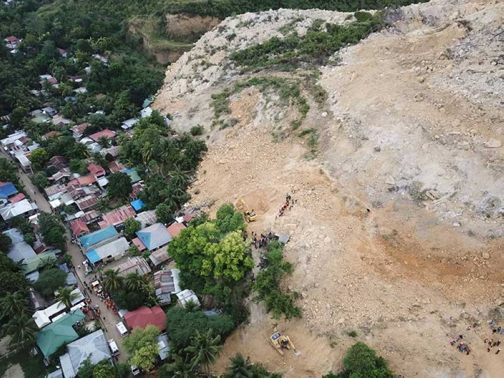 At least 21 dead as landslide engulfs dozens of homes in Naga City