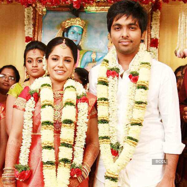Musician GV Prakash Kumar poses with his wife Saindhavi after their wedding ceremony, held at