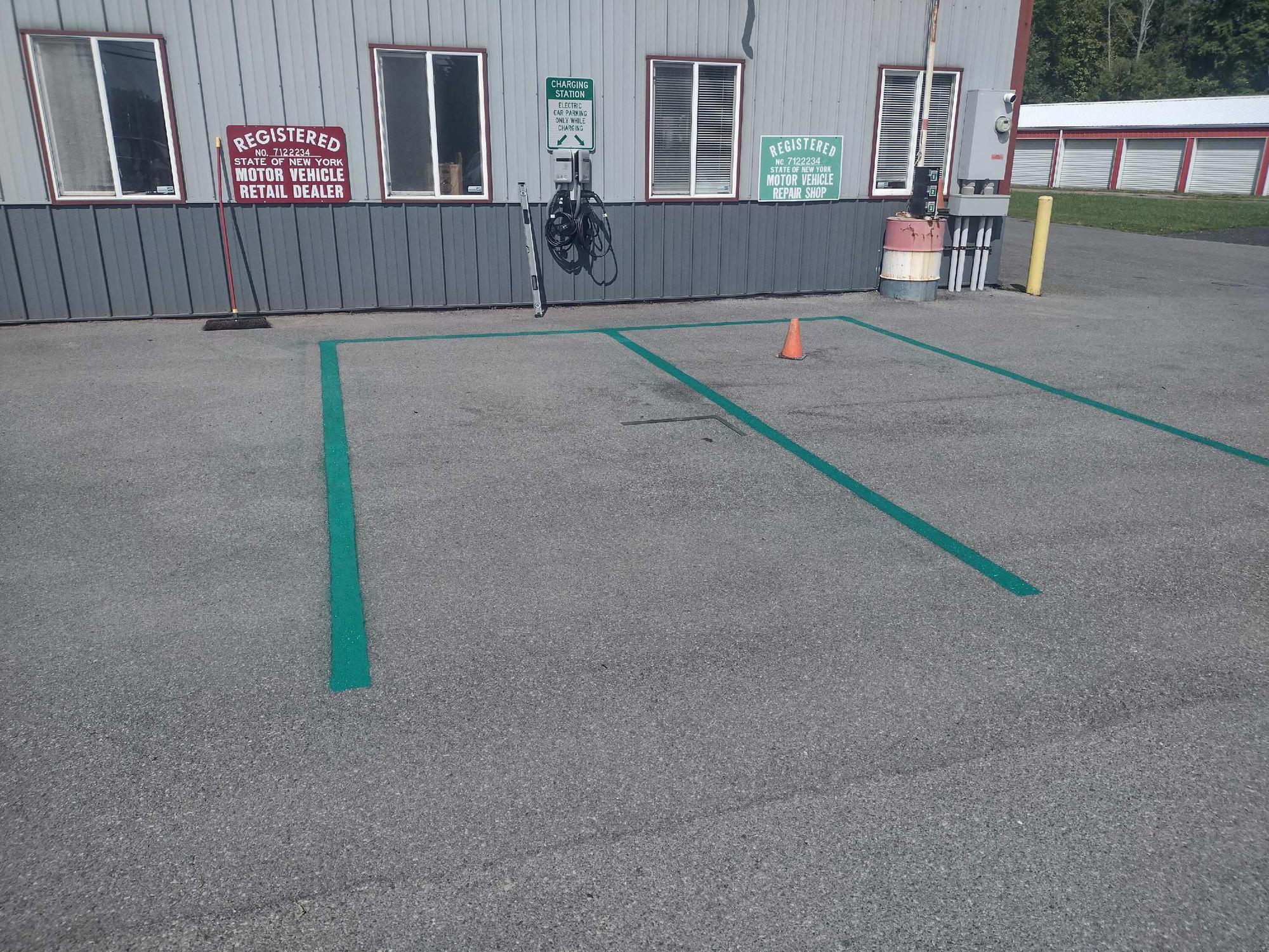 Malone's Garage & UStore on 104 Oswego, NY EV Station