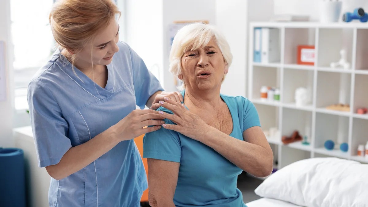 What causes pain on tip of shoulder?