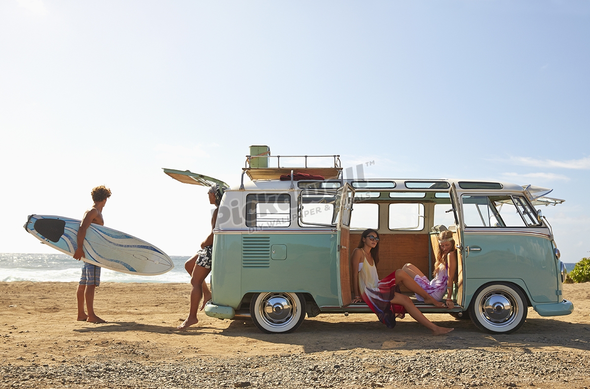 Van relaxing on beach Pickawall