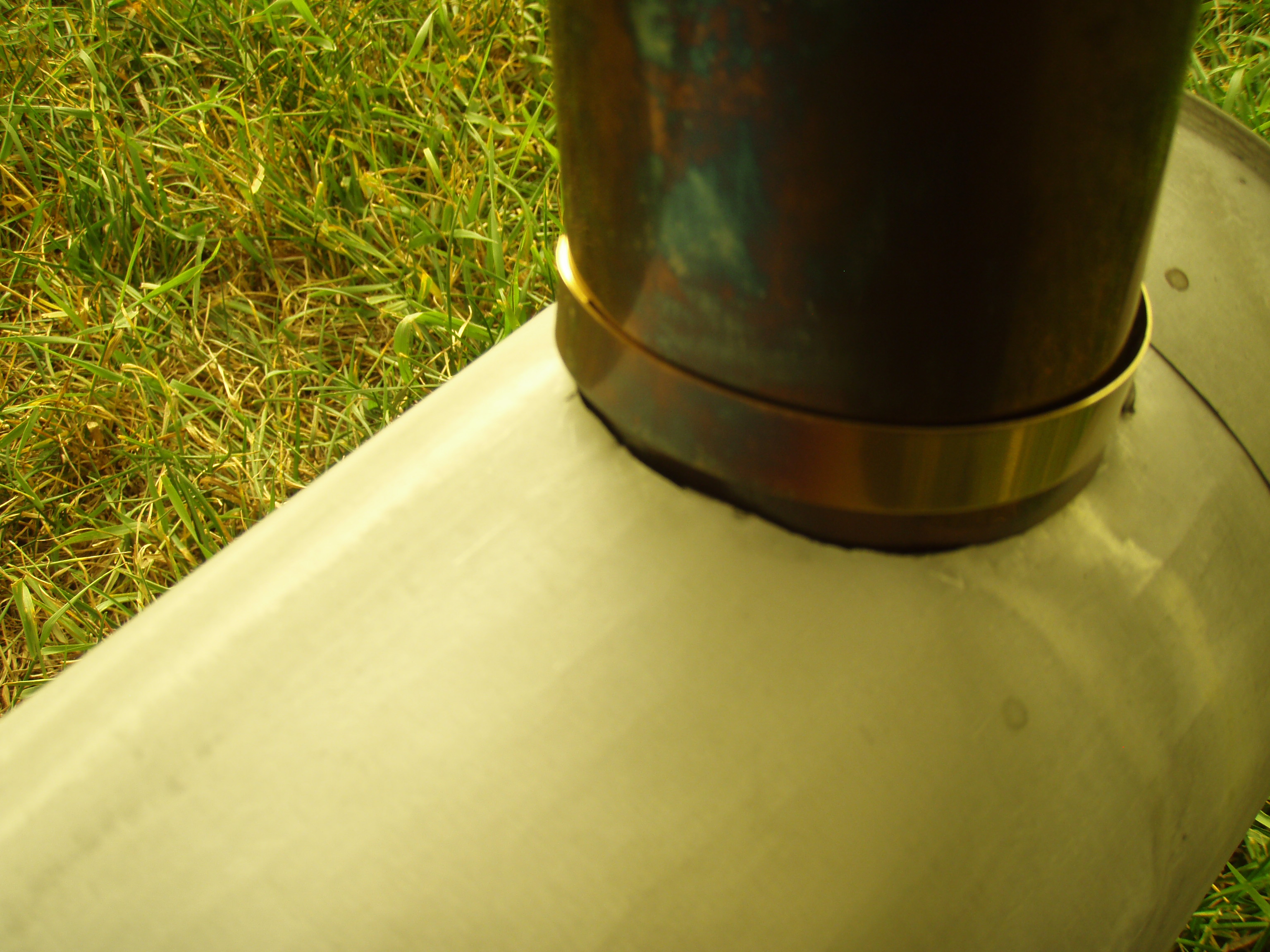 No need to get fancy for the pipe hole in the stove. I just cut a hole