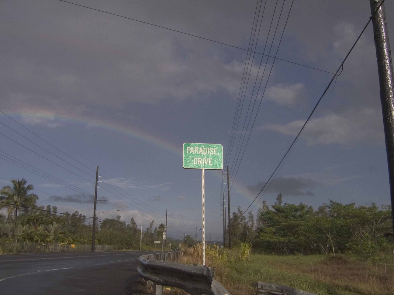 Hawaiian Paradise Park, HI Rainbow behind the sign for Paradise Drive