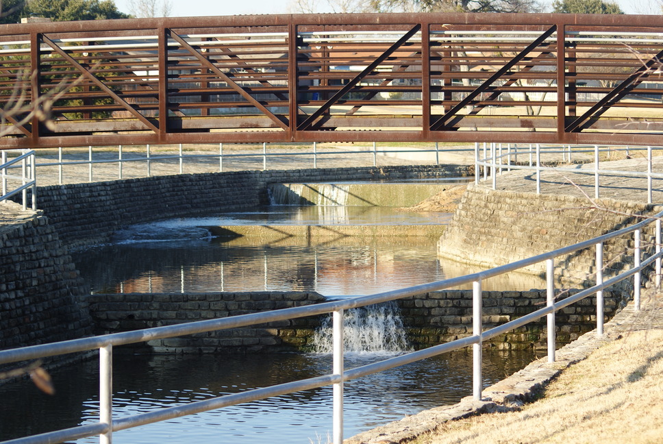 Carrollton, TX water flow under the bridge on the greenbelt in