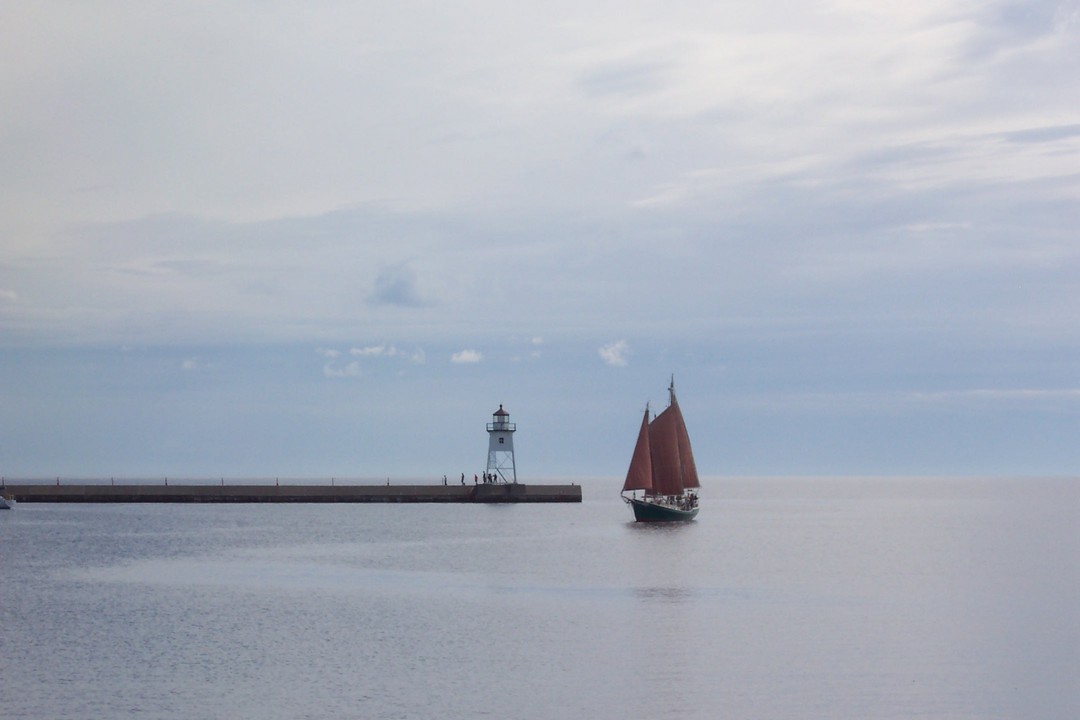 Grand Marais, MN Grand Marais Lighthouse and Schooner Hjordis photo
