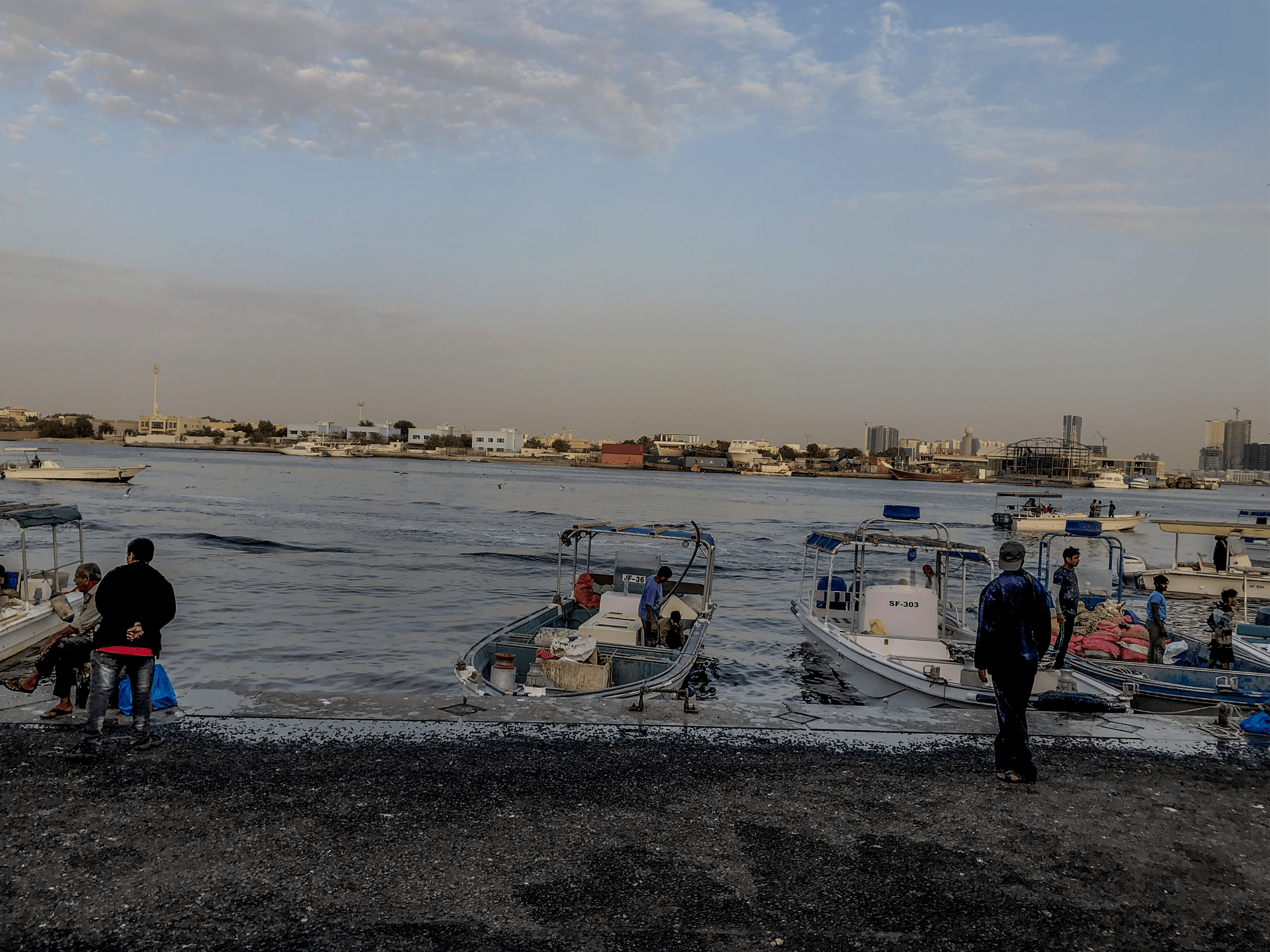 Ajman Fish Market Filipina having fun and buying the local way