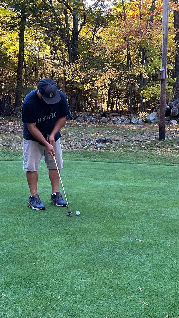 Lining up a putt Play Golf at Pine Hollow Little Par 3