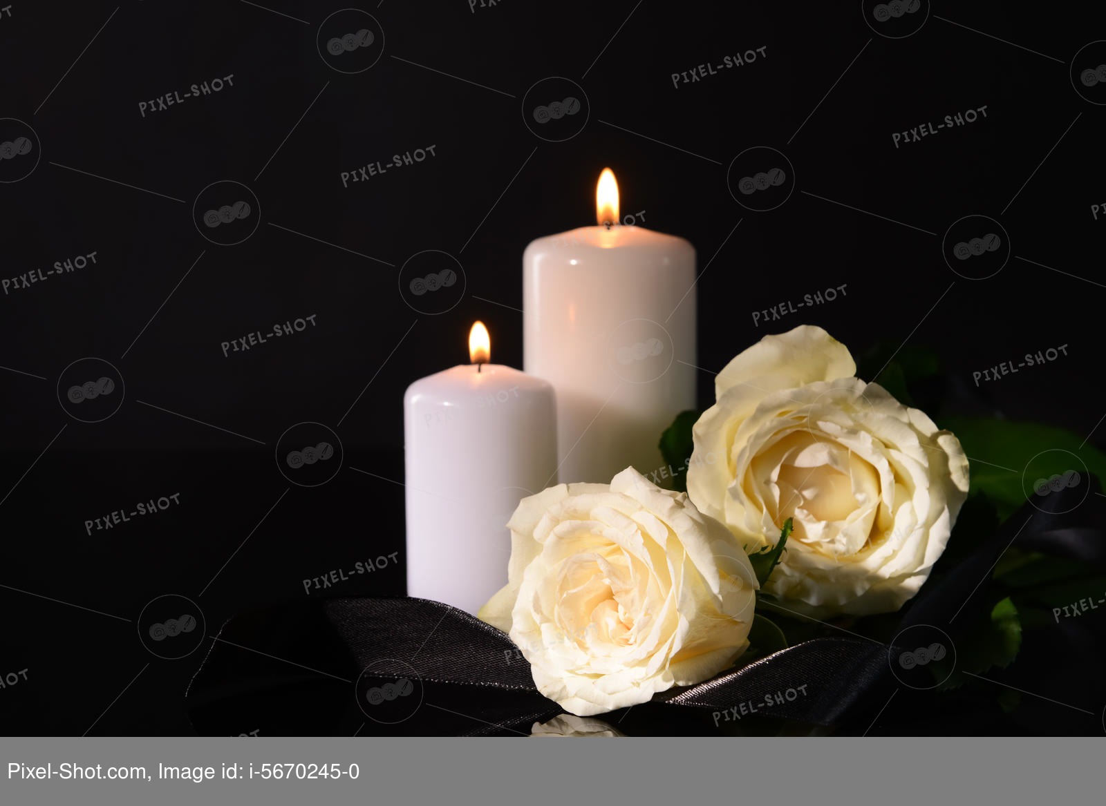 Burning candles, mourning ribbon and flowers on black background