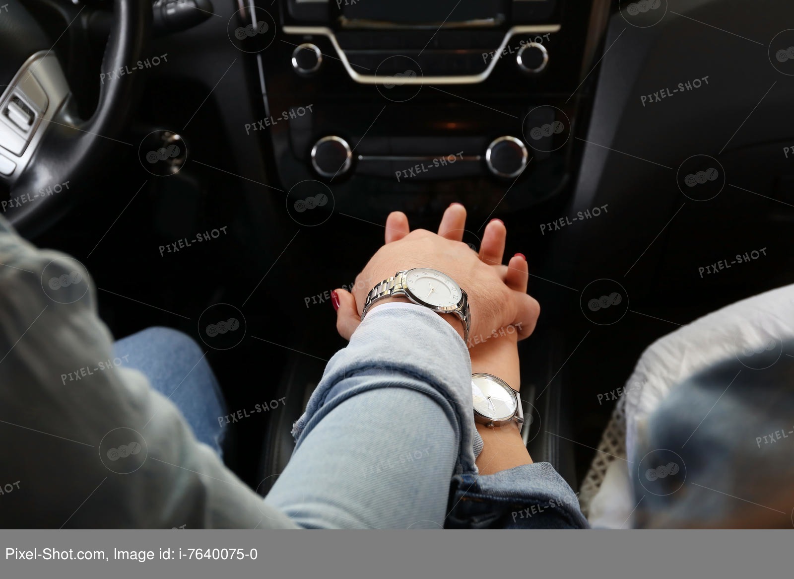 Couple Holding Hands In The Car