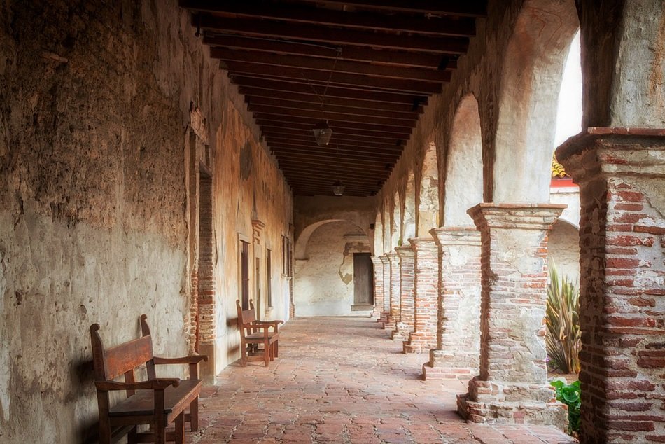 Benches in passage of Mission San Juan Capistrano, historic landmark and museum, usa, california