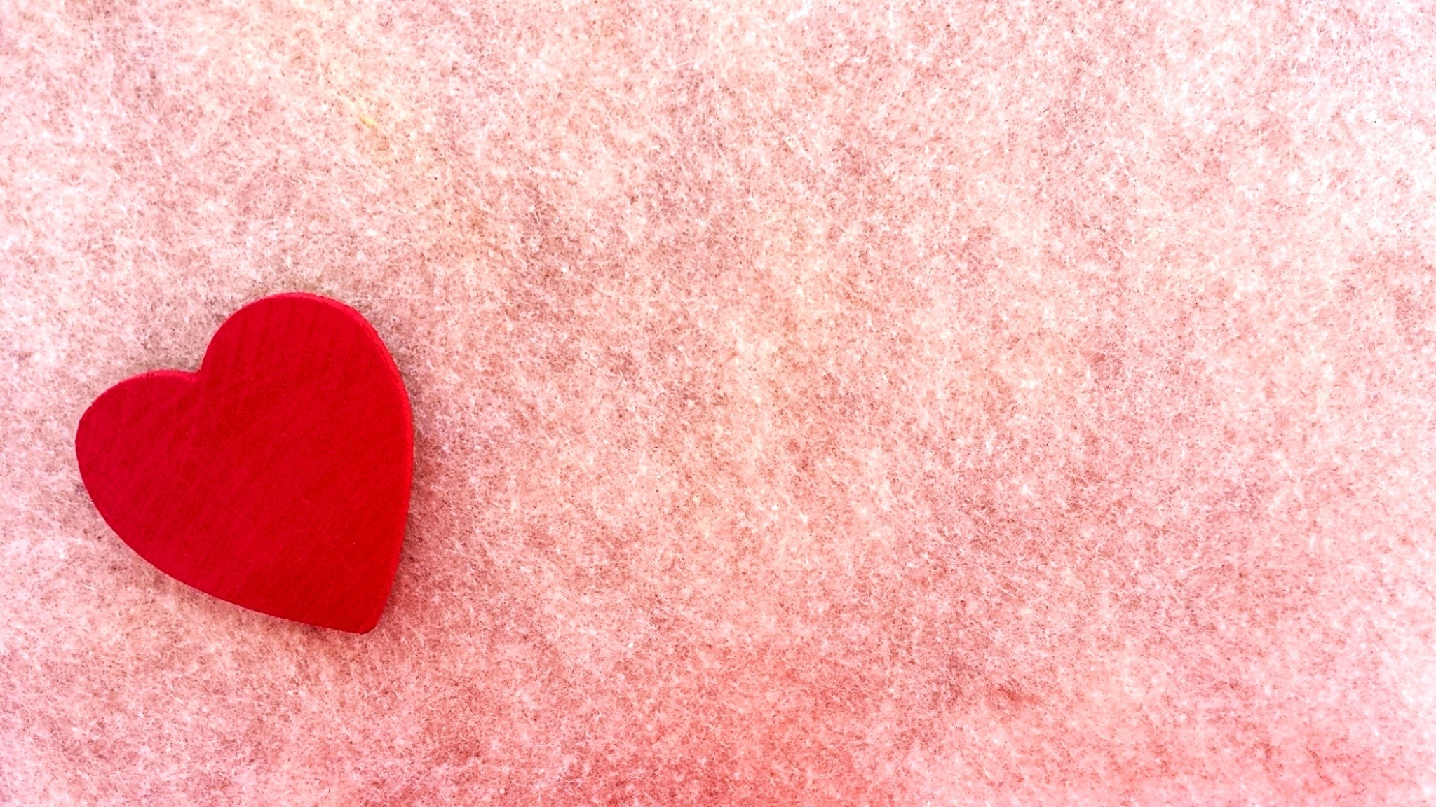 Red heart on a pink fabric free image download